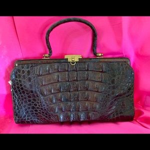 One hundred plus years old alligator bag.